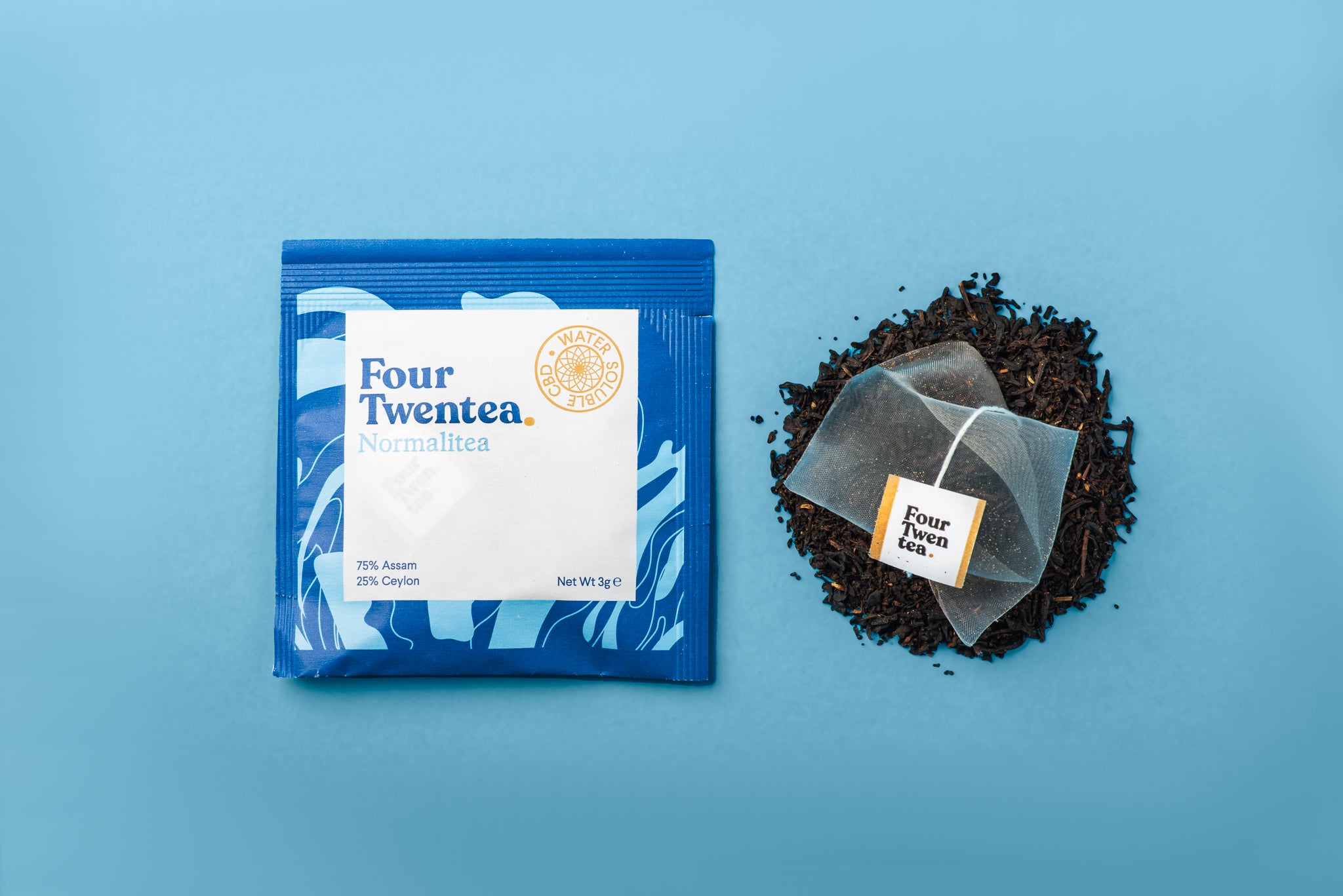 Flat lay of Four Twentea Normalitea CBD tea bag and ingredients. It's English Breakfast CBD tea.